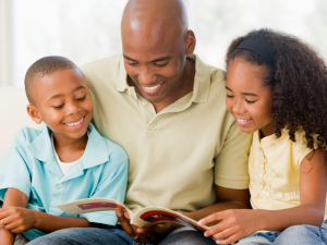 Man Reading to Kids